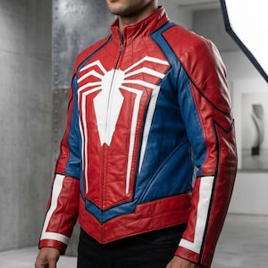 May include: Red, blue, and white leather jacket with a full-zip closure. The jacket features a large white spider emblem on the chest and white stripes on the sleeves. The jacket has a quilted design.