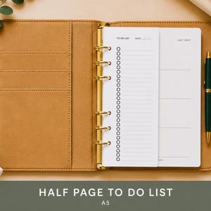 May include: A tan leather-like A5 planner with a gold six-ring binder mechanism, featuring a white insert with a to-do list and a July 2027 calendar page. A dark green pen is tucked into the side loop of the planner cover.