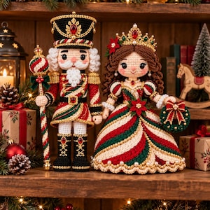 May include: A pair of crocheted dolls featuring a nutcracker soldier in a red, green, and white uniform holding a staff and a princess in a matching striped gown with a crown, both adorned with gold accents and small red and white beads.
