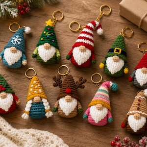 May include: A collection of ten crocheted gnome keychains featuring various designs, including holiday-themed hats with stars, stripes, reindeer antlers, and snowflakes, each with a white beard, a round nose, and a gold-toned metal keyring attached.