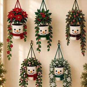 May include: Five crocheted snowman-shaped hanging planters suspended from a wooden rack. Each white planter features a snowman face with an orange nose and black eyes. They are decorated with poinsettias, holly, pine branches, candy canes, and snowflakes.