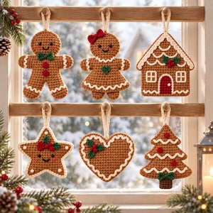 May include: A set of six crocheted Christmas ornaments in brown yarn with white icing-style trim. The shapes include a gingerbread person, a gingerbread person with a red bow, a gingerbread house, a star, a heart, and a Christmas tree.