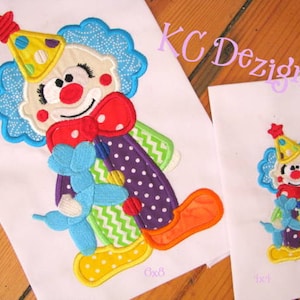 May include: Two embroidered designs of a clown holding a balloon. The larger design is 6x8 inches and the smaller design is 4x4 inches. Both designs feature a colorful clown with a red nose, blue hair, and a purple and white polka dot outfit.