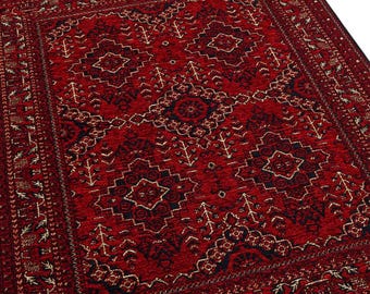Puede incluir: Una alfombra rectangular roja con un intrincado patrón geométrico y un borde con flecos. La alfombra presenta un diseño central con formas de diamante y estrella, y el texto "Carpetmia" es visible en las esquinas superior izquierda y derecha.