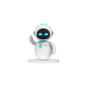 Puede incluir: Un juguete robot blanco y turquesa con un diseño amigable. El robot tiene una cabeza redonda con una cara negra y ojos azules brillantes. Está saludando con un brazo y tiene la palabra "Eilik" impresa en su cuerpo.