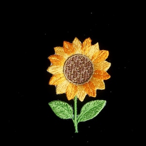 Solrosblommig lapp, strykapplikation, broderad