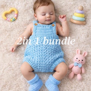 May include: A baby wearing a light blue crochet romper and matching booties, with wooden buttons. The image includes a pink crochet bunny, a yellow teething ring, and a wooden stacking toy. The text "2in 1 bundle" is visible.