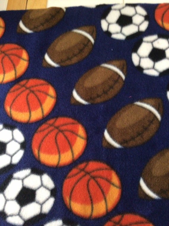 REMNANT-3/8 yard fleece fabric-sports balls