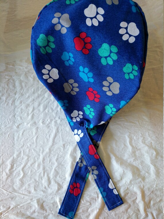 scrub cap-paw prints on blue background