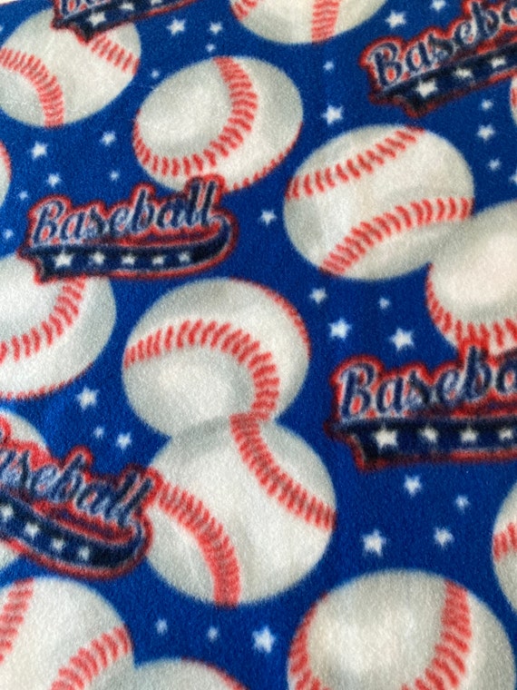 REMNANT-1/2 yard-fleece fabric-baseballs on blue background