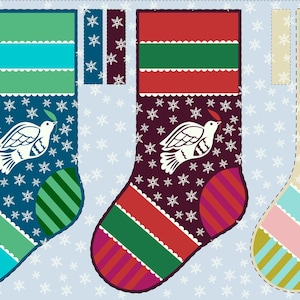 May include: Three Christmas stockings with a dove design, each with a different color scheme. The stockings have a blue, burgundy, and beige background with snowflake patterns. Each stocking has a different color scheme, including green, red, and pink stripes.