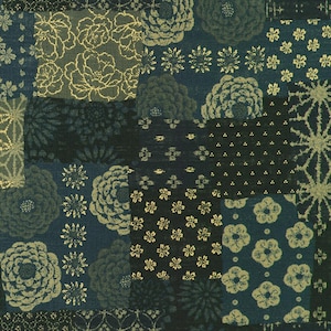 May include: A patchwork fabric with a blue background and gold floral patterns. The fabric is made up of different squares with various floral designs, including roses, daisies, and other abstract patterns.