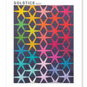 May include: A quilt pattern featuring a colorful geometric design with a repeating starburst pattern. The pattern is called "Solstice Quilt" and is by Nydia Kehnle & Alison Glass. The quilt is available in two sizes: 40" x 56" and 64" x 84".