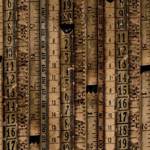 May include: A close-up of multiple vintage wooden measuring tapes with faded brown and white markings. The numbers 1 through 20 are visible on the tapes.