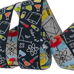 May include: Black and white ribbon with a science theme. The ribbon features illustrations of beakers, atoms, protractors, and mathematical equations. The text "Cube = a³" and "90°" are visible on the ribbon.