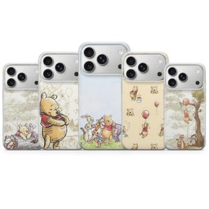 May include: Five phone cases with illustrations of Winnie the Pooh characters. Each case displays a different scene, including Pooh, Piglet, Tigger, and Rabbit. The cases have a clear border and a glossy finish.