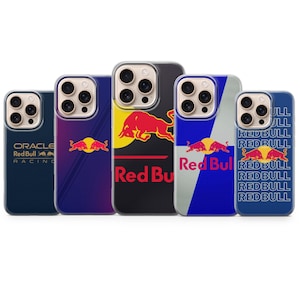 May include: Five phone cases showcasing Red Bull branding. Designs include the Red Bull logo, the words "Red Bull", and the Oracle Red Bull Racing logo, in red, yellow, and blue. The cases are designed for a smartphone.