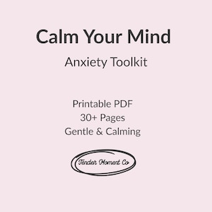 May include: A digital product with the text "Calm Your Mind Anxiety Toolkit." The image includes the phrases "Printable PDF," "30+ Pages," and "Gentle & Calming." The Tender Moment Co. logo is at the bottom, all on a light pink background.
