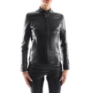 May include: A black leather jacket with a zipper closure and a stand-up collar.