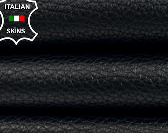 May include: Close-up of black leather material with a textured surface. The leather is folded over itself, showing multiple layers. The Italian Skins logo is visible in the upper left corner.