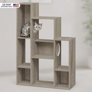 May include: A gray cat peeks out from a round opening in a multi-level cat tree. The cat tree is made of gray wood and has multiple shelves and openings for the cat to explore and rest. The cat tree is designed to provide a comfortable and stimulating environment for cats.
