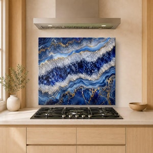 May include: A rectangular kitchen backsplash panel featuring a high-resolution print of blue and white agate stone with crystalline textures and veins of gold. The design displays wavy, layered patterns in deep navy, royal blue, and white tones.