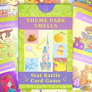 May include: A Theme Park Smells stat battle card game box centered on a background of various illustrated game cards. The box features a central castle graphic surrounded by icons of a swirl, orange, lollipop, cake, and water splash on a green field.