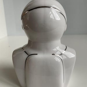 Back view of vintage Soviet cosmonaut porcelain bust in glazed white finish, Verbilki factory