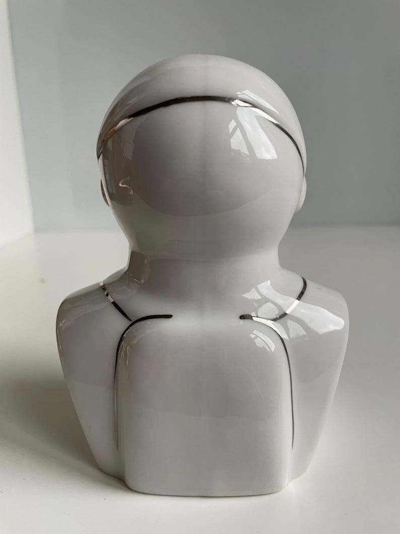 Back view of vintage Soviet cosmonaut porcelain bust in glazed white finish, Verbilki factory