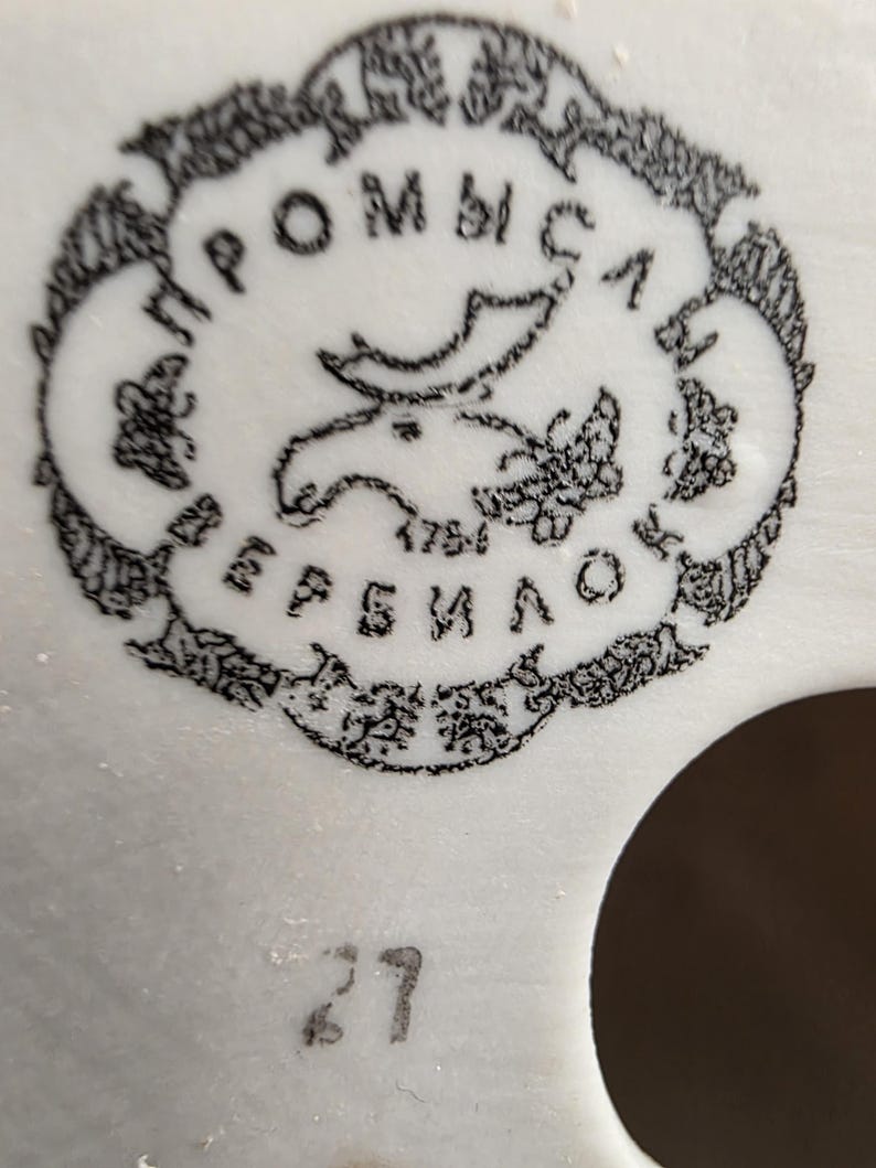 Close-up of Verbilki porcelain factory mark on vintage USSR cosmonaut bust, post-Soviet period
