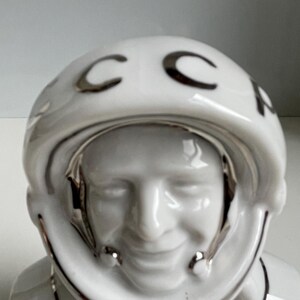 Close-up of face of vintage Soviet cosmonaut porcelain bust, glazed white sculpture