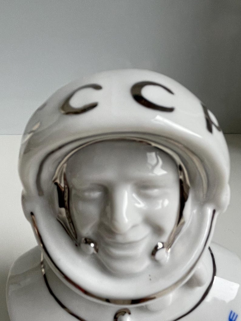 Close-up of face of vintage Soviet cosmonaut porcelain bust, glazed white sculpture