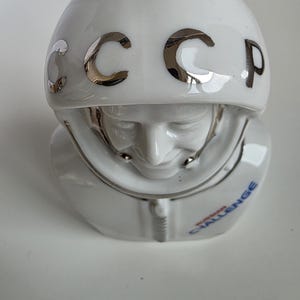 Top view showing USSR lettering on helmet of vintage Soviet cosmonaut porcelain bust