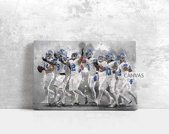 May include: A canvas print featuring a stylized image of a football team in action. The players are wearing white uniforms with blue accents and helmets. The word "CANVAS" is visible on the right side of the print.