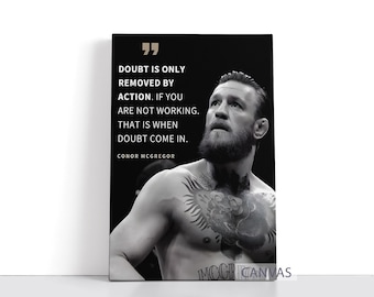 May include: Black and white canvas print featuring a portrait of Conor McGregor with a quote: "Doubt is only removed by action. If you are not working, that is when doubt come in." The canvas has the text "MCGRICANVAS" at the bottom.