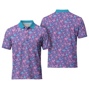 May include: Two short-sleeved polo shirts with a repeating pattern of cartoon figures in shades of purple, pink, and teal. The shirts have a teal collar and button placket. One shirt is viewed from the front, the other from the back.
