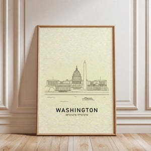 May include: A vertical wall art print on textured cream paper featuring a black line drawing of the Washington D.C. skyline, including the Capitol building and Washington Monument. The text reads WASHINGTON 38°53'42"N 77°02'12"W.