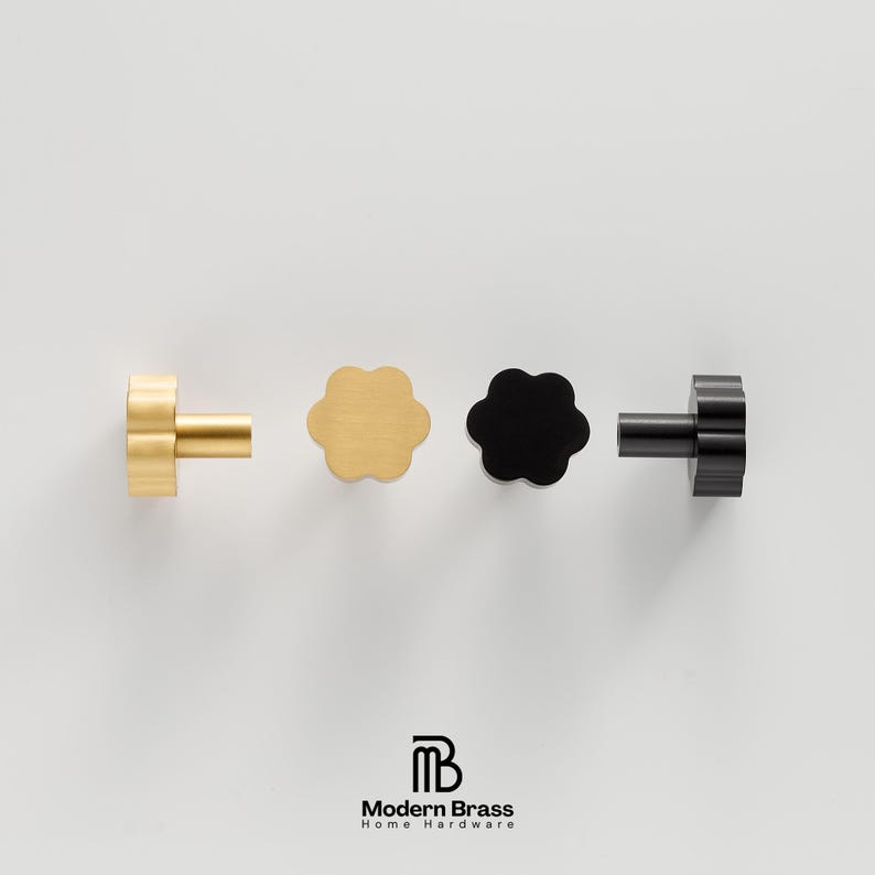 A solid brass round drawer knob with a matching antique brass finish for a cohesive furniture look.