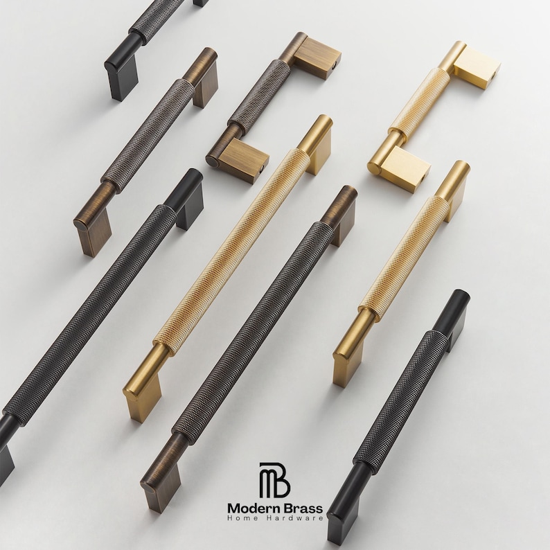 Architectural flat bar drawer pulls featuring soft rounded ends in brushed antique brass.