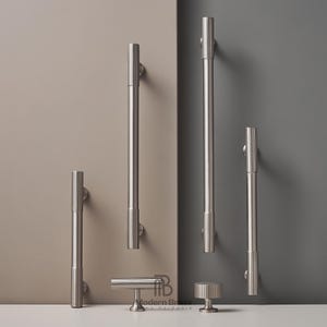 May include: A collection of brushed nickel cabinet hardware, including various sizes of bar pulls, a knob, and a T-shaped pull. The hardware is displayed against a neutral background, showcasing the modern design and finish.