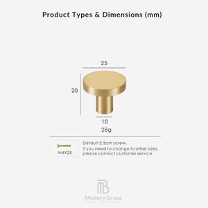 Brushed brass circular cabinet knob featuring a flat top and cylindrical stem for a minimalist look.