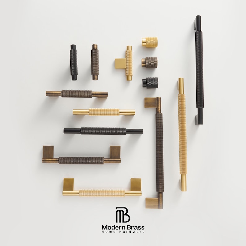 Close-up of solid brass hexagonal knobs displayed on mounting stems with a warm satin texture.