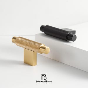 Luxury antique brass cabinet pulls with a weathered, timeless dark gold patina.