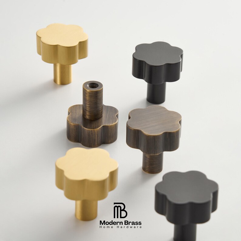 Textured brass drawer pulls with a diamond-cut grip surface and sleek, modern square mounting bases.