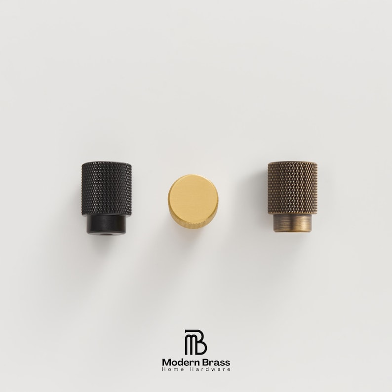 Fingerprint-resistant brushed gold handles and knobs ideal for heavy-use kitchen pantries.
