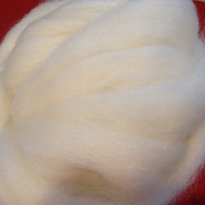 May include: A large amount of white wool roving, a type of fiber used for spinning and felting.