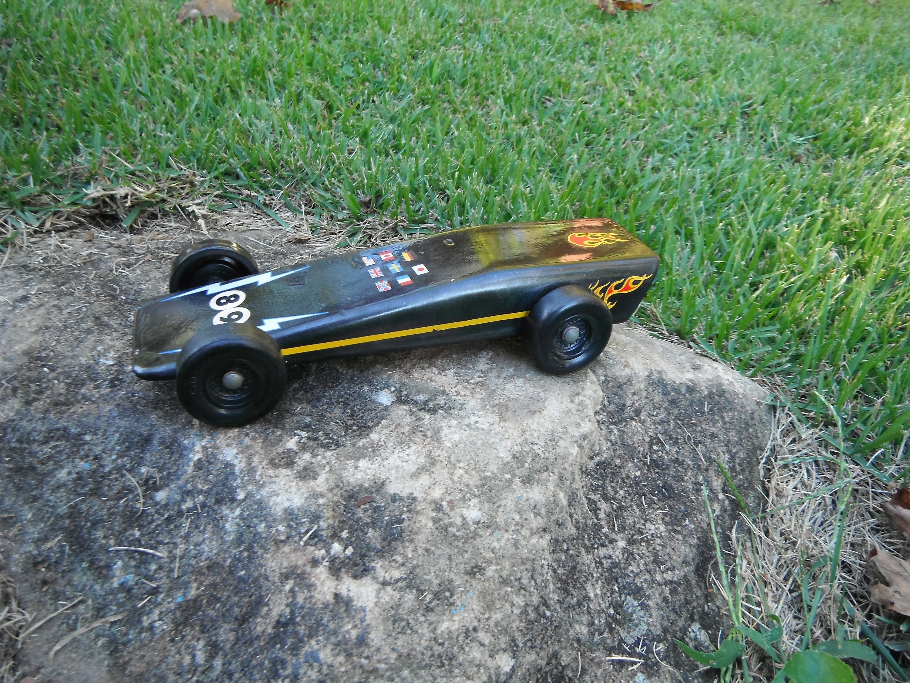 Vintage Black Pinewood Derby Race Car With Flames and Flag Decals 