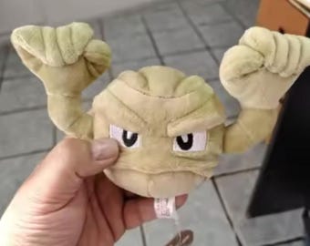 Bring a little nostalgic charm and personality to your space with this adorable plush inspired by Geodude! 18cm