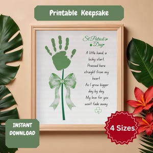 May include: A framed St. Patrick's Day keepsake print featuring a green handprint design, bow, and poem. The print includes the text "Printable Keepsake", "Instant Download", and "4 Sizes". The artwork is in a wooden frame.