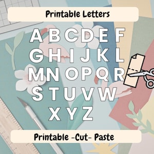 May include: A set of printable letters featuring the alphabet from A to Z in a bold white font with black outlines. The image includes the text Printable Letters and Printable -Cut- Paste, alongside a craft knife, scissors, and paper cutouts.
